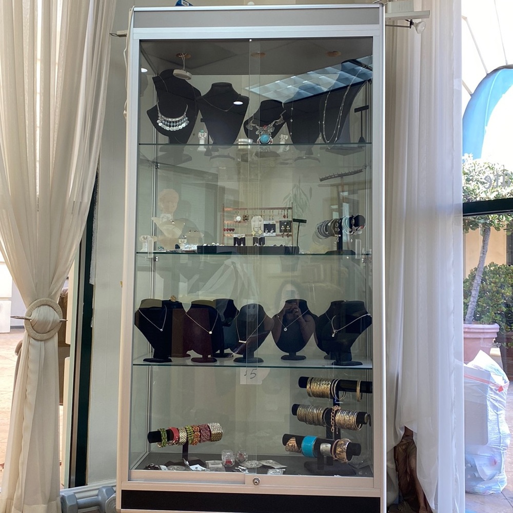 Glass double door show case and hair dryer chair in a brand new condition